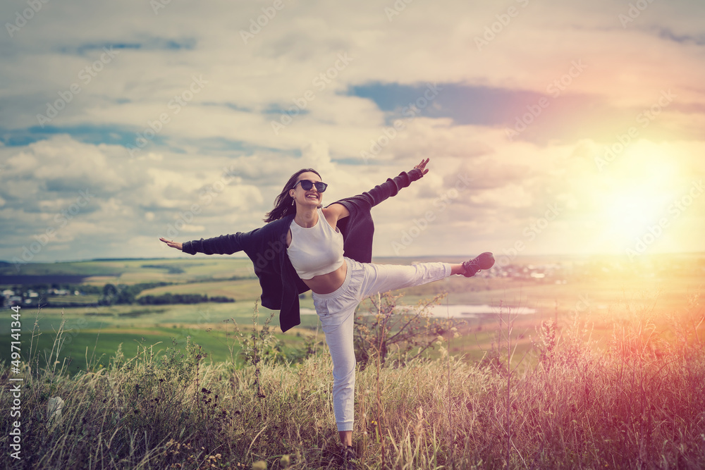 Portrait beautiful caucasian woman in the green field in summer time Portrait beautiful caucasian woman in the green field in summer time