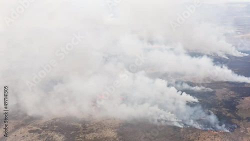 Aerial view of a large, active grass fire in Wales (UK) photo