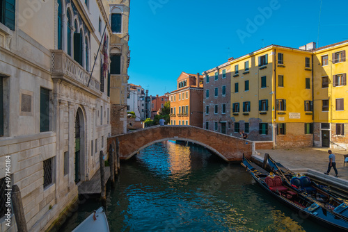 View of gondolier waiting for customers at empty canals and venice in pandemic