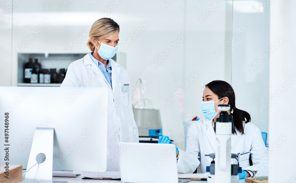Working on new research. Shot of two scientists working together in a lab. Working on new research. Shot of two scientists working together in a lab.
