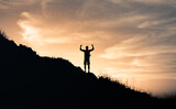 Adventure, and goal setting concept. silhouette of a person on the top of mountain