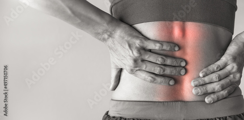 Woman suffering from lower back pain  photo