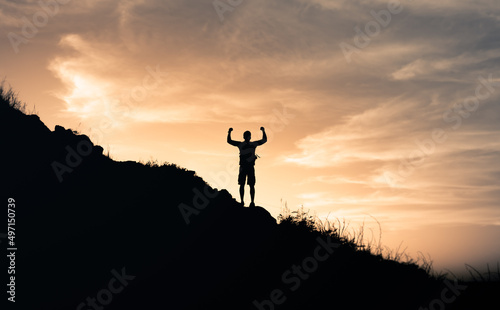 Adventure  and goal setting concept. silhouette of a person on the top of mountain