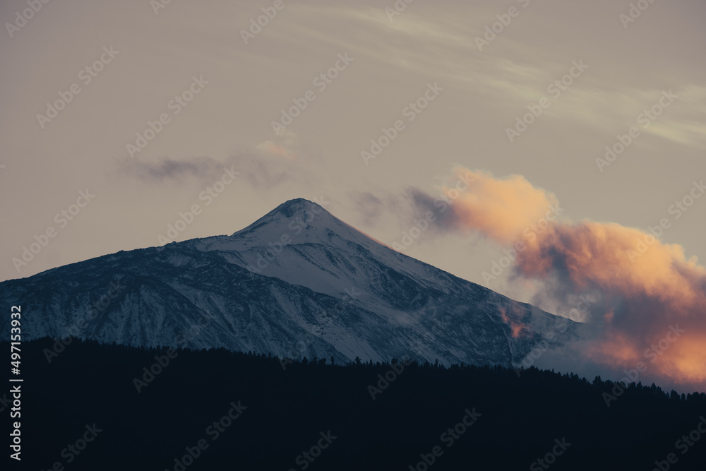 The snow covered volcano El Teide in the evening at sunset
Teide on the Canary Island of Tenerife is the highest mountain in Spain. The summit is covered with snow. Telephoto shot from the northeast