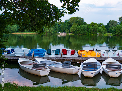 Rowing boats and pedal boats for rent at the landing stage in the lake