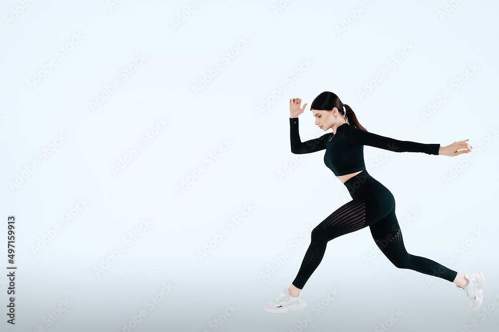 Woman runner in silhouette on isolated background. Dynamic movement. Side view