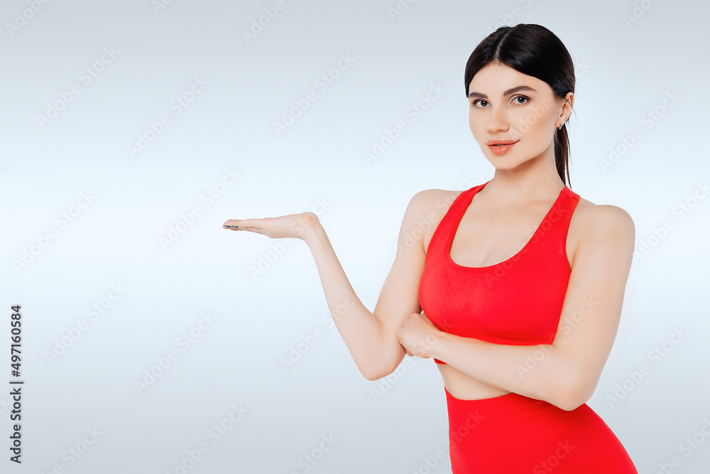 Beatiful fitness woman with palm for holding something. Isolated Beatiful fitness woman with palm for holding something. Isolated