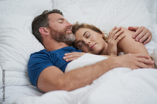 Wallpaper Mural Love makes the sweetest embrace. Shot of a happy middle aged couple relaxing in bed together. Torontodigital.ca