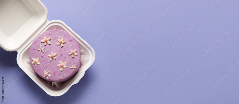Lunch box with tasty bento cake on lilac background with space for text Lunch box with tasty bento cake on lilac background with space for text