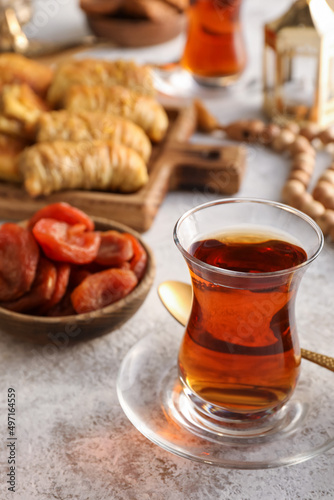 Cup of tasty Turkish tea on grunge background