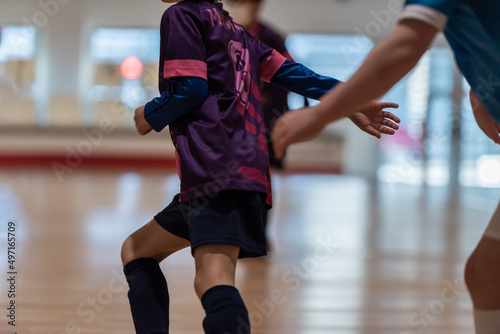 a player escapes her opponent dribble in a regional game