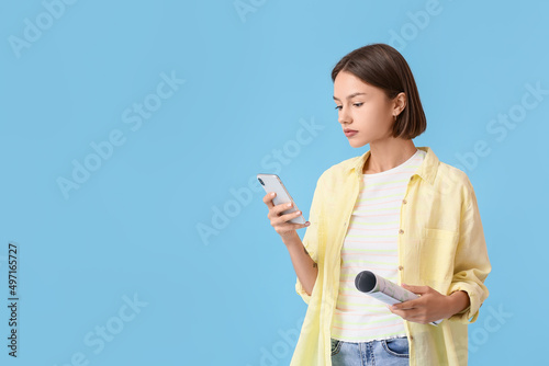 Young woman with map and ph...