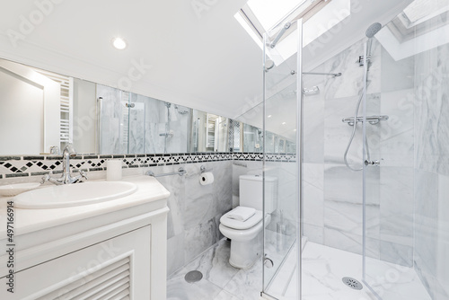 Bilde på lerret bathroom with white furniture, shower cabin with transparent sliding screen, wal