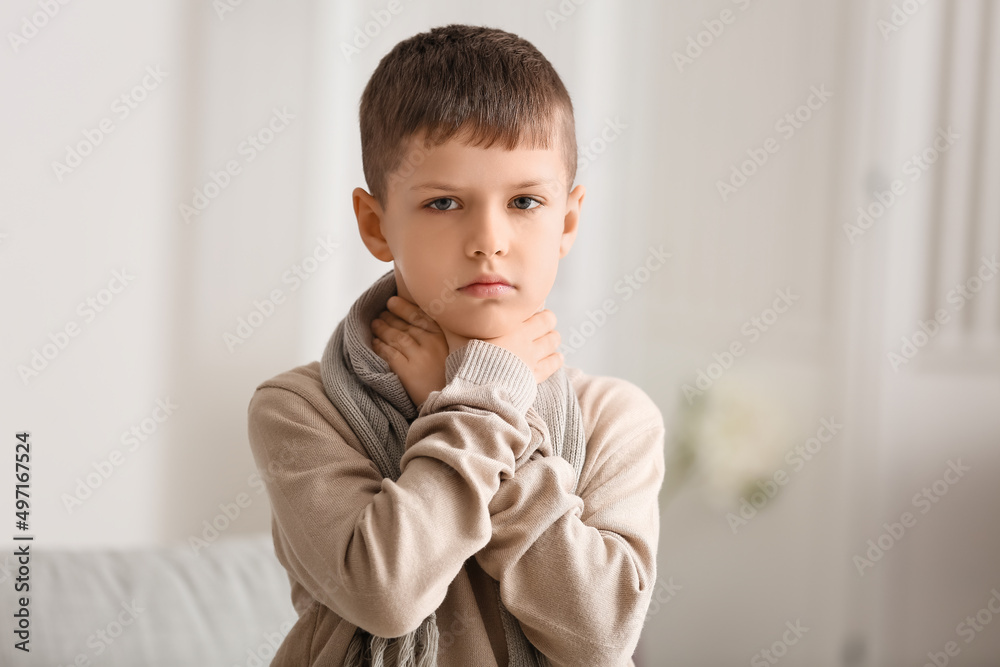 Ill little boy with sore throat at home Ill little boy with sore throat at home