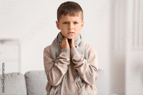 Ill little boy with sore th...