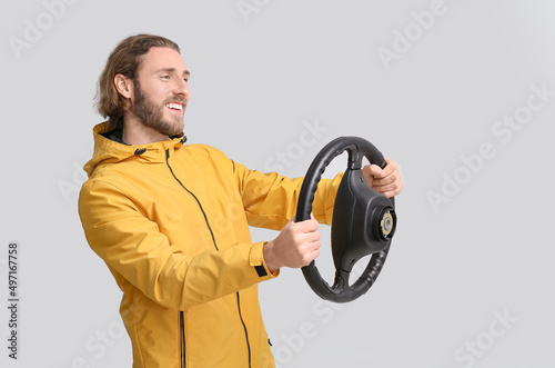Handsome man with steering ...