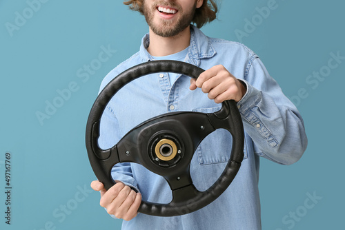 Handsome man with steering ...