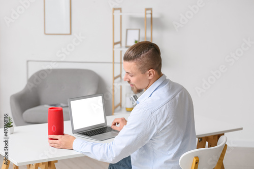 Young man connecting wirele...