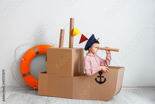 Funny little boy playing wi...