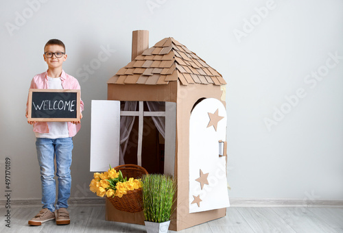Funny little boy playing wi...