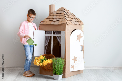 Funny little boy playing wi...