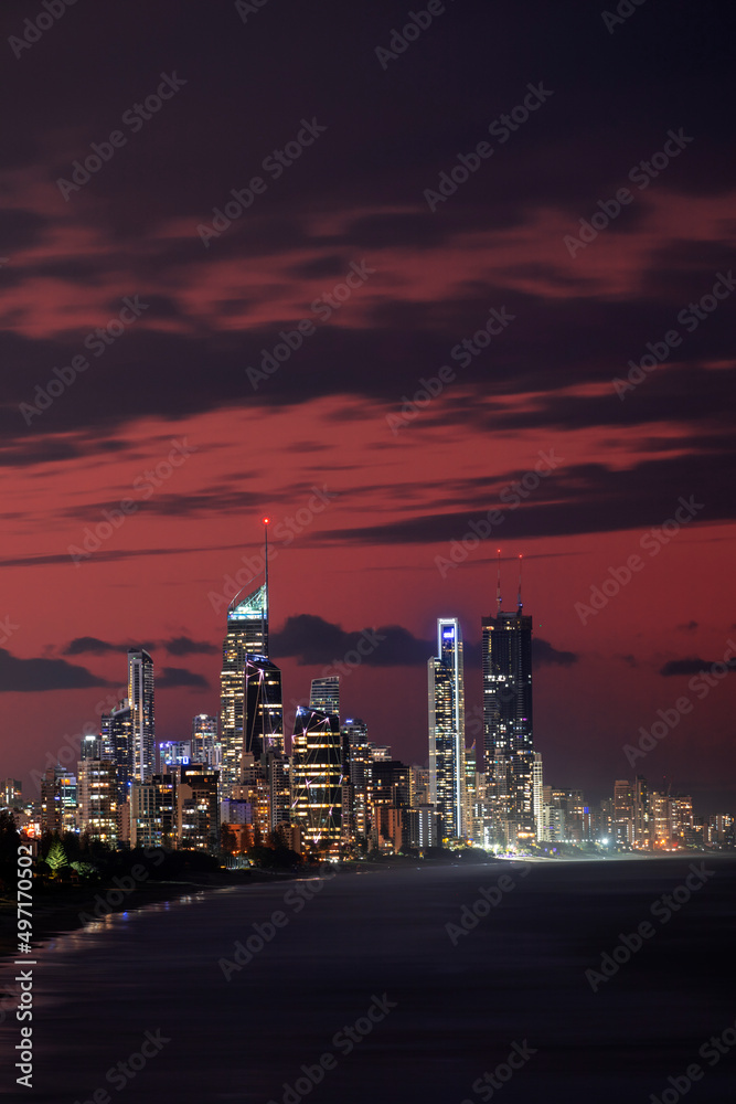 Fototapeta premium Cloudy orange sunset skies over Gold Coast, Australia. View from Miami Lookout