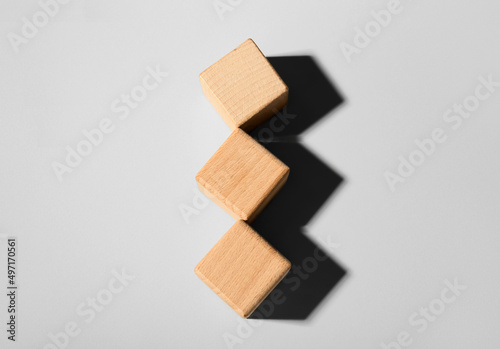 Wooden cubes on light backg...