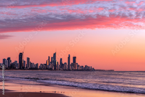 Pink clouds at sunrise over Surfers Paradise, Gold Coast. View from Burleigh beach