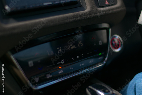 hybrid electric car dashboard climate control system with capacitive touch LED display, temperature controls, fan speed controls, airflow, air circulation  infotainment display. © Pulasthi Keragala