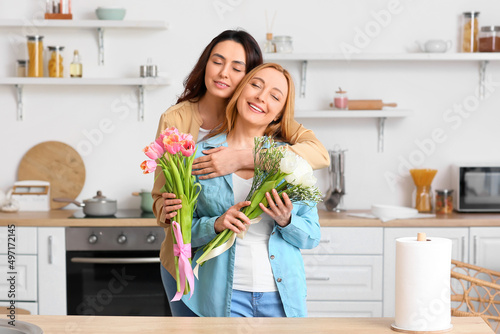 Happy Women Embracing with ...