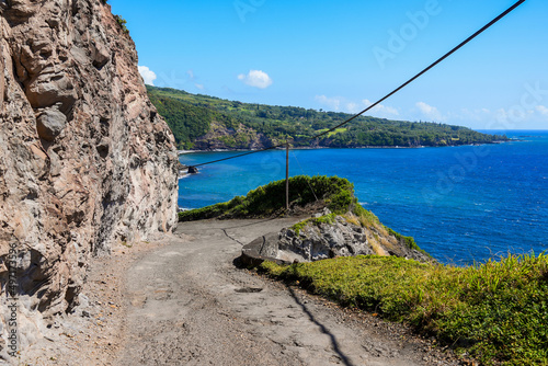 Sinuous dirt road along the Pacific Ocean of Piilani Highway in the southeast of Maui island in Hawaii photo