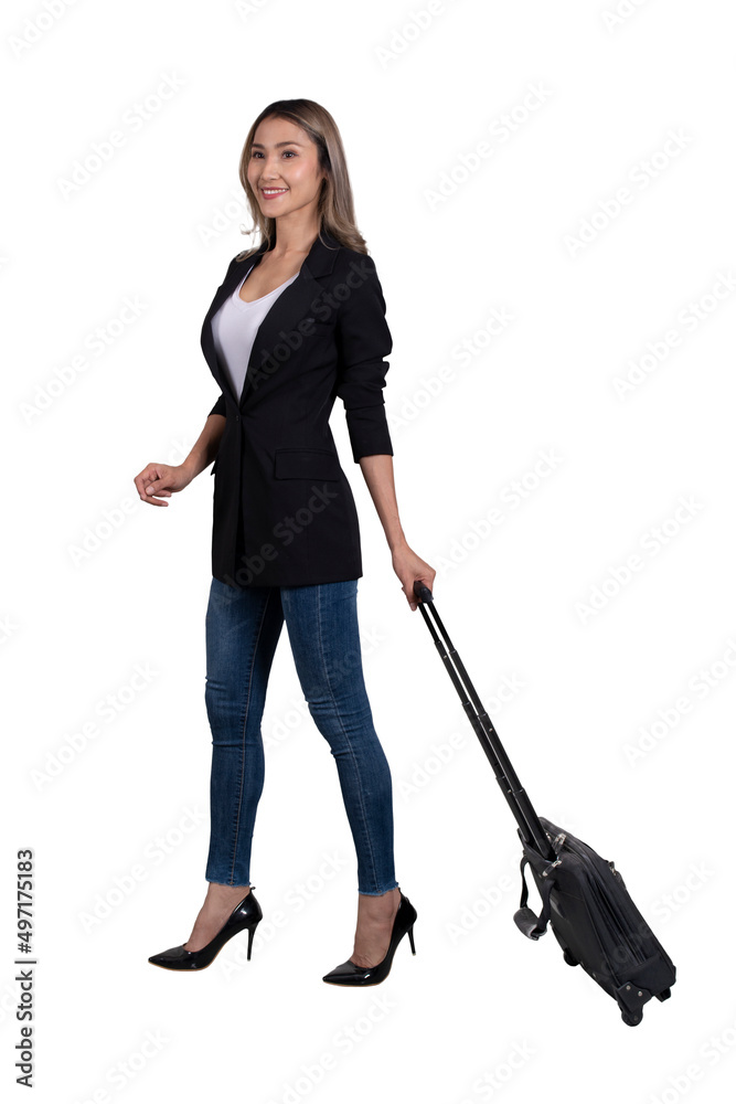 Side view photo of businesswoman walking forward and pulling baggage. Side view photo of businesswoman walking forward and pulling baggage.