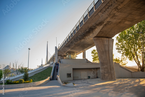 Golden Horn metro bridge, stairs. Suleymaniye Mosque view in the background, Istanbul photo