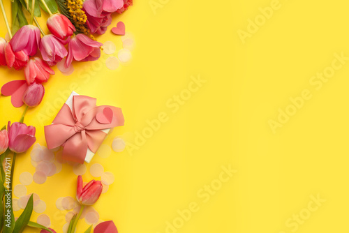 Greeting card. Bouquet of colorful tulip flowers gift box on yellow, copy space, invitation card. Spring time seasonal holiday, 8 march International woman day, Mother day, banner, flyer