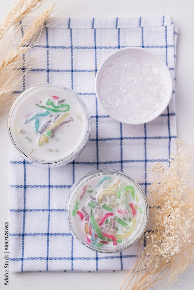 Thai dessert (Lod Chong), Colorful rice flour jelly with coconut milk in glass and ice, Top view Thai dessert (Lod Chong), Colorful rice flour jelly with coconut milk in glass and ice, Top view