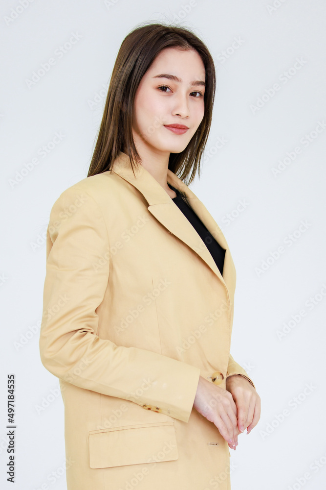 Portrait studio isolated cutout shot Asian young beautiful female professional successful businesswoman in casual business suit standing hold hands together smiling look at camera on white background Portrait studio isolated cutout shot Asian young beautiful female professional successful businesswoman in casual business suit standing hold hands together smiling look at camera on white background