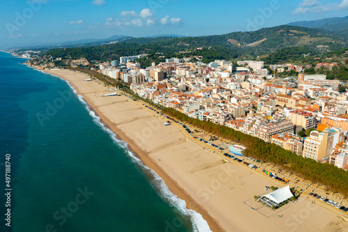 Aerial view from drone of Calella Beach on sunny autumn day in Catalonia, Spain photo