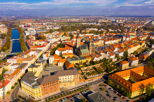 Panoramic aerial view of autumn Hradec Kralove townscape with Renaissance clock tower and Gothic Cathedral on sunny day, Czech Republic..