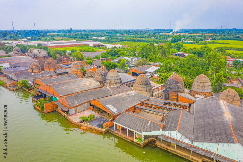 Obraz premium Aerial view of Mang Thit brick kiln in Vinh Long. Burnt clay bricks used in traditional construction of Vietnamese