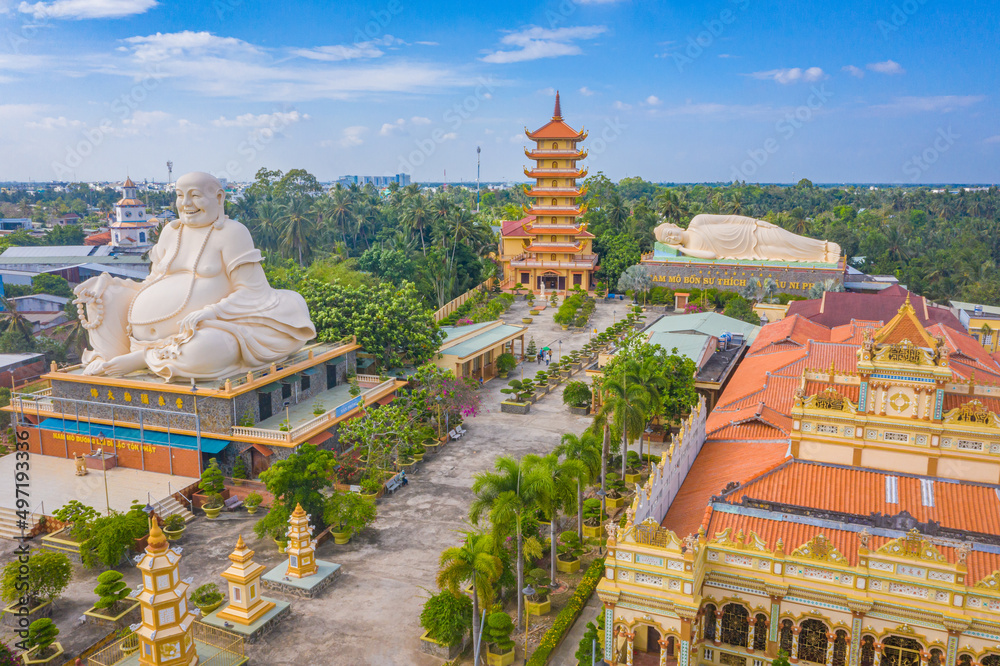 Naklejka premium Aerial view of Vinh Trang pagoda. A historical - cultural monument that attracts visitors in My Tho, Tien Giang, Vietnam. Near Ben Tre. Mekong Delta