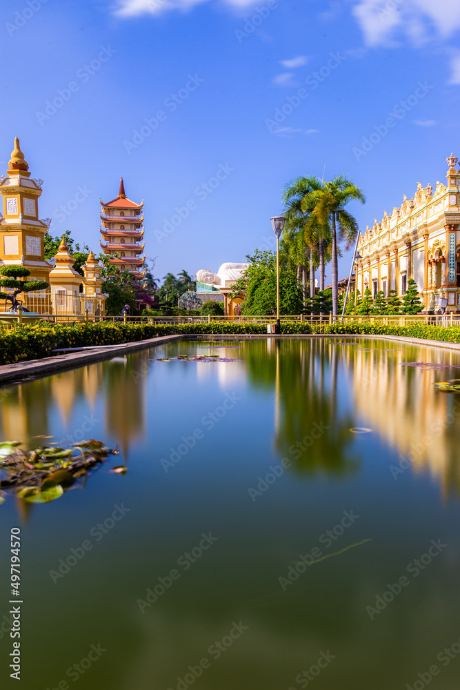 Fototapeta premium Beautiful day in Vinh Trang Pagoda in My Tho city, the Mekong Delta, Vietnam.