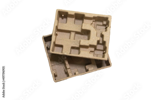 Cardboard lodgment isolated on white background. Package recycling. Safety product transportation and delivery. photo