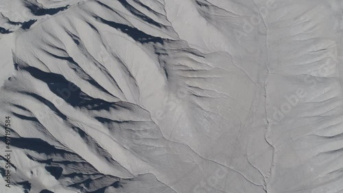 Top down aerial above gray bentonite desert textures in Caineville, Utah photo