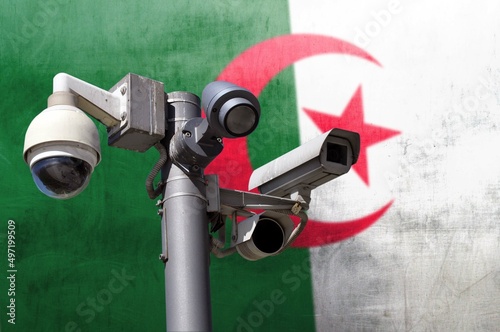 Closed circuit camera Multi-angle CCTV system against the background of the national flag of Algeria.