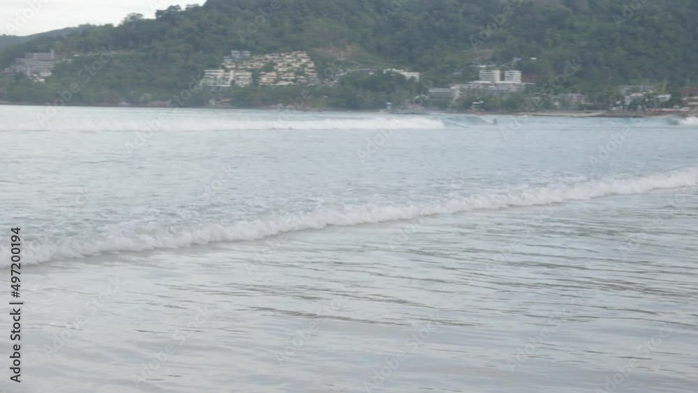 the beach with white sand and calm wave from peaceful sea in summer sunshine daytime.Summer vacation nature concerpt the beach with white sand and calm wave from peaceful sea in summer sunshine daytime.Summer vacation nature concerpt