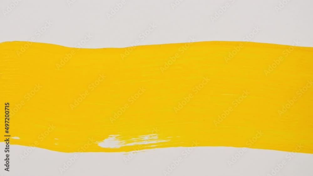 Abstract brushstrokes of yellow paint brush applied isolated on a white background. Yellow paint smear texture. Yellow sparkling textured artistic illustration. Smears of cosmetics. High quality 4k 