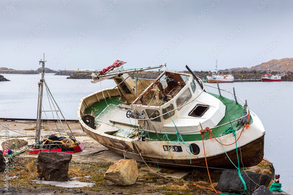 Sto Norway 02-28-2022. Fishing boat wreck landed on the shore at Sto in Vesteralen islands. Norway.