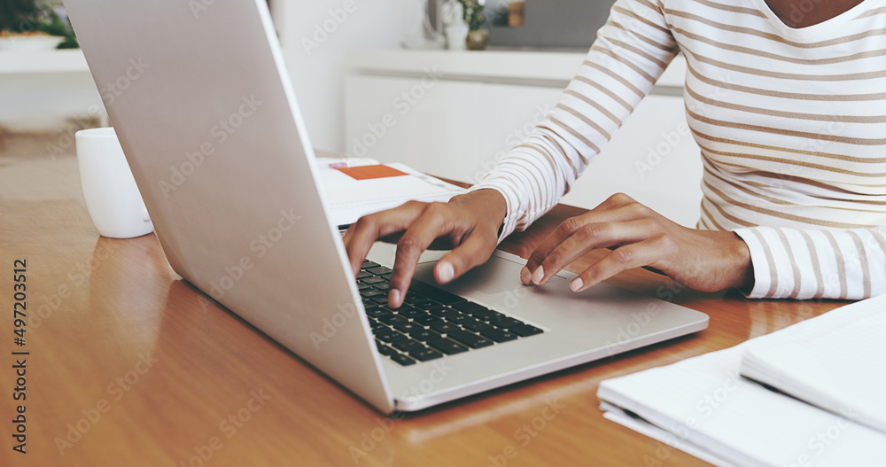 I have to work from home today. Shot of an unrecognizable womans hands typing on a laptop while being seated next to a table at home. I have to work from home today. Shot of an unrecognizable womans hands typing on a laptop while being seated next to a table at home.