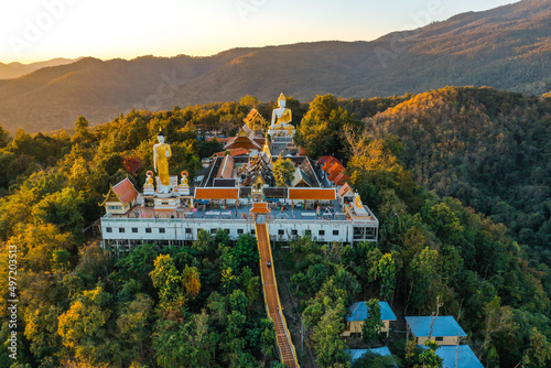 Aerial view of Wat Phrathat Doi Kham, Buddha pagoda and golden chedi in Chiang Mai, Thailand