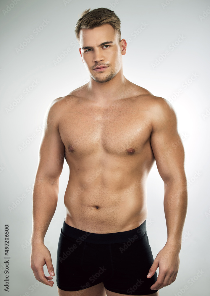 Doubt makes you weak. Studio portrait of a muscular young man posing against a grey background.